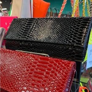 Black faux snake skin clutch. NWT